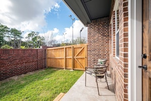 Private backyard that can be accessed from all bedrooms. Outdoor furniture is different from the above staging.