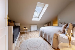 Bedroom in lower part with a queen bed and a convertible day bed