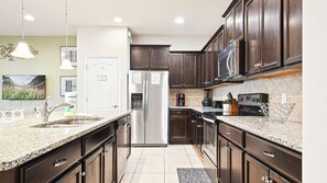 Create culinary delights in our fully-equipped kitchen, where you can cook up a storm during your stay.