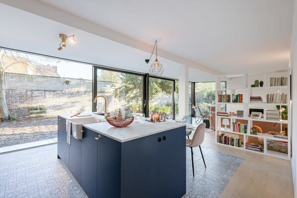 Open concept kitchen next to dining table