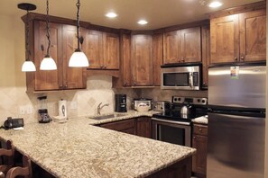 Full kitchen with all the necessities to cook with.