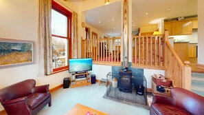 TV and wood burning stove at Carriden