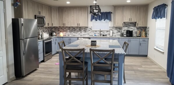 Updated kitchen with 6-chair island/table -  lots of space for the whole family!