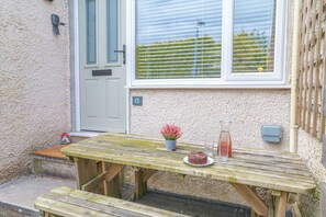 Outdoor seating area at the front of the property