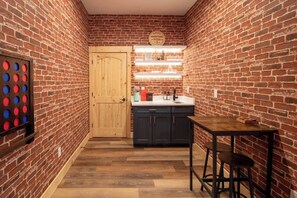 Beautiful bar with accent lights ready with cocktail recipes and Bartender Kit.