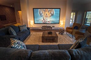 120" screen with sound-bar for an immersive movie theater experience.
