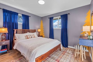 Sleep soundly in this vibrant, cozy bedroom.