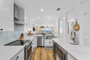 Large Open Concept Kitchen with stainless steel appliances.