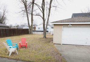 Enjoy the spacious, dog-friendly fenced yard, perfect for your furry friends to run and play safely. Whether it's fetch or simply lounging outdoors, this secure area offers a great space for your pets to enjoy during your stay.