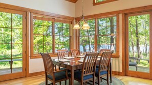 Lake views surround the open concept dinning area