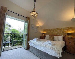 Master rear facing king-sized bedroom + balcony, ensuite, wardrobe & soft linens