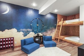 Enjoy movie nights in the coolest sleepover room ever, designed for the ultimate in fun and coziness.