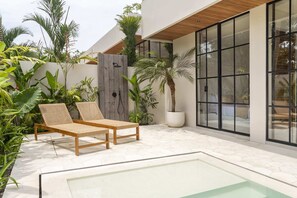 Two daybeds near the swimming pool