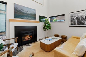 Living Room: Bright and airy space with a warm fireplace and stylish decor—perfect for relaxation!