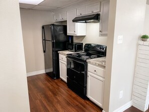 Cook and dine in comfort with basic cookware, dinnerware, and a well-equipped kitchen.