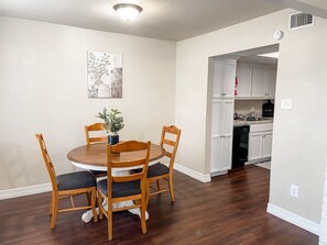 Relax and dine at the comfortable four-seater table.