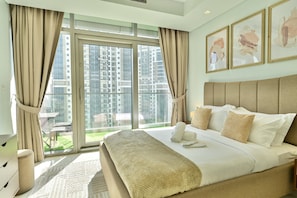 Our king-size bedroom beckons with lavish comfort and elegant desing