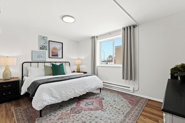 Retreat to this spacious king bedroom, where comfort and tranquility combine for the ultimate relaxation.
