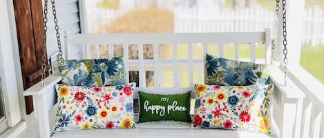 Unwind on the porch swing amid birdsong as neighbors walk their dogs.