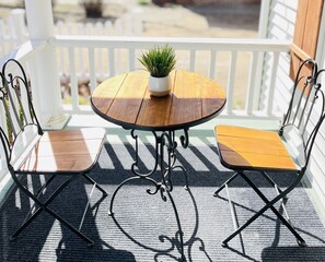 Tea for two on the front porch while listening to the birds singing