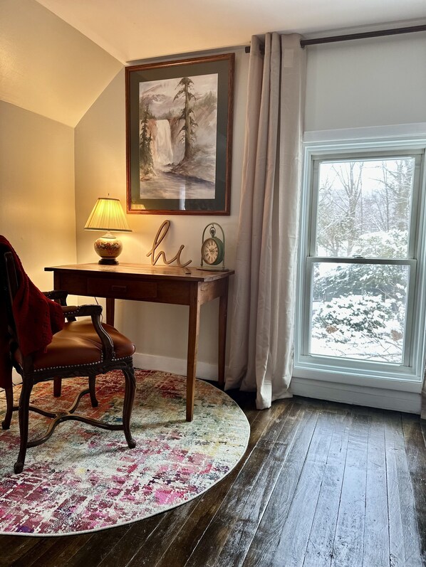 Cozy work space, overlooking the trees, with lots of natural light.