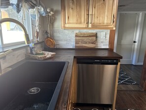 Beautiful ebony butcherblock countertops! Complimentary dishwashing starter kit.