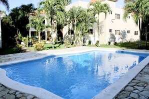 A nice pool with exclusive lounge chair and tables for Royal 5 guests only