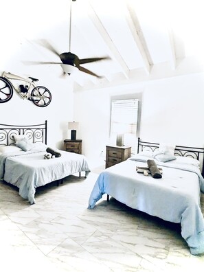 The second bedroom has flexibility with two full size beds and AC. 