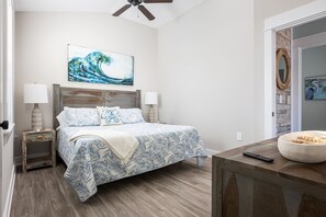 Main Bedroom with King size bed and wireless charging stations for Apple devices