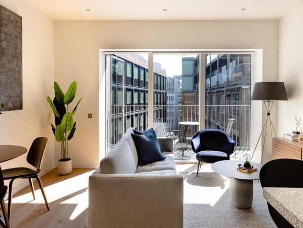 Light and airy lounge with sofa, TV
