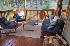 Spacious outdoor covered deck among the trees