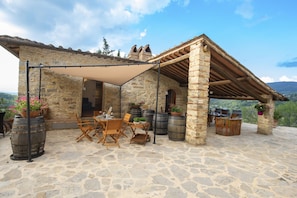 Outdoor Area: Dine under the Tuscan sky in the outdoor kitchen, equipped with tables, chairs, and everything needed for an unforgettable alfresco dining experience.