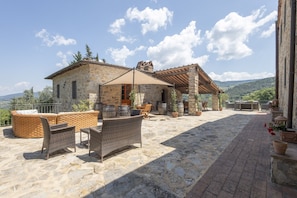 Outdoor Area: Dine under the Tuscan sky in the outdoor kitchen, equipped with tables, chairs, and everything needed for an unforgettable alfresco dining experience.