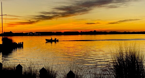 Sunset fishermen enjoy the evening on Little Assawoman Bay