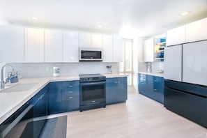 Whip up gourmet meals in the fully-equipped kitchen, boasting sleek countertops and state of the art appliances