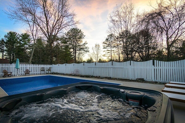 The backyard is built for fun, relaxing, and spending time with family/friends. A well maintained hot tub, pool with loungers, and a nice fire pit area with seating.