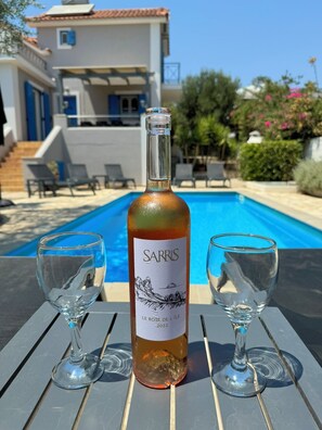 Enjoy a glass of local Kefalonian wine at the Pool or Pessada Beach!