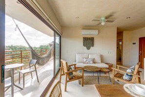 Open the floor-to-ceiling doors to extend the living space