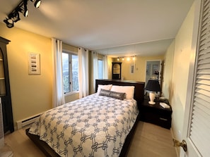 Downstairs bedroom with queen bed