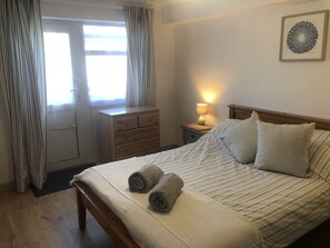 Good sized bedroom with direct access to small patio area