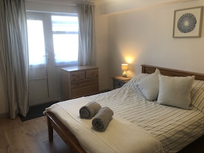 Good sized bedroom with direct access to small patio area
