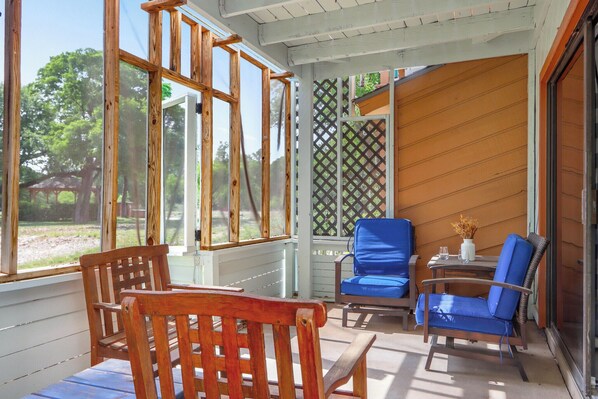 Enjoy the outdoors from the comforts of the screened in porch