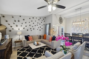 Featuring loft ceilings, comfortable seating, and designer décor, this chic living area was designed for creating great memories with family and friends!