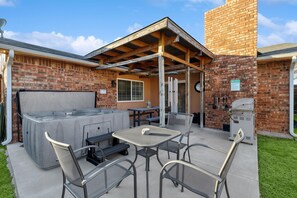 This patio has it all! From easy al fresco meals at the outdoor dining set to warm, relaxing soaks in the hot tub, you can relax to your heart’s content here!