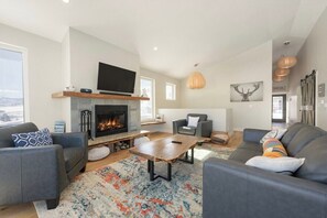 SWP Lances Adventure Lodge living room fireplace and TV