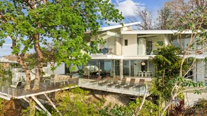 Nature becomes part of the home with the Ron Ron tree centering the extended deck with expansive vistas.  