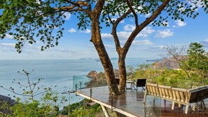 Nature becomes part of the home with the Ron Ron tree centering the extended deck with expansive vistas.