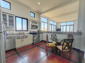 The fully-equipped eat-in kitchen has full-size appliances including a dishwasher.  