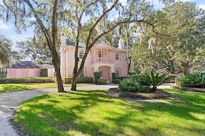 The property is filled with several hundred year old Oak trees and Palm trees. 