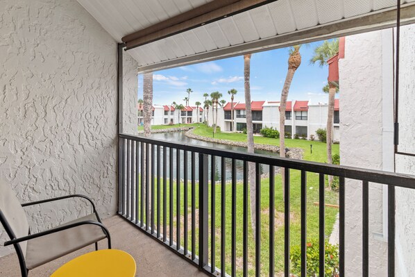 Balcony With Table And Chairs To Enjoy Palm Tree Scenery